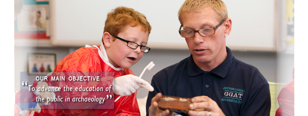 A child asking a GGAT archaeologist about the pot he has justed washed