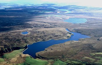 Modern reservoir fed by the Afon Aled in valley on northern edge of Mynydd Hiraethog.