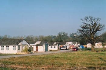 Varied field pattern resulting from enclosure of common open fields associated with ridge and furrow and former medieval manorial centres and late enclosure of areas of common grazing, 'green' encroachment settlements and remains of two large US Army hospitals and subsequent Polish hospitals.