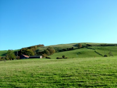 Steeply sloping hill edge south of the Severn valley with widely dispersed farms, woodland plantations of 19th-century origin and mostly regular fieldscapes probably representing enclosure of former upland grazing and former common land in the 18th and 19th centuries.