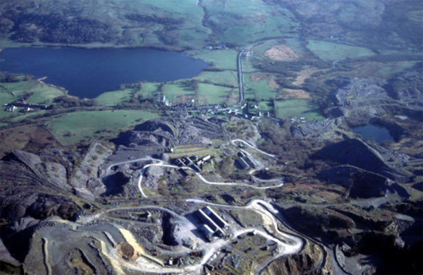 This aerial view, which looks south, shows Pen-yr-orsedd, the only operational quarry in Dyffryn Nantlle, in the foreground, with part of Dorothea to the right. The village of Nantlle (area 13) lies just beyond, set between the quarries and the valley floor (area 49).
