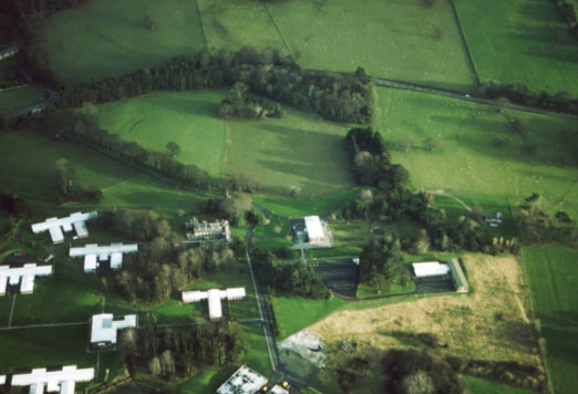 SH 677746 looking south. Showing the edge of Bryn y Neuadd park and garden (on the Cadw Register) in the foreground (the white buildings are the hospital), with the enclosed, Victorian, managed landscape clearly visible beyond.