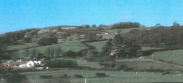 SH 813790 looking north. Showing the elevated nature of the prominent limestone ridge, with conspicuous disused quarries and settlements, which rises above the more open, enclosed landscape of Creuddyn (area 6)