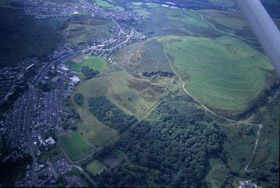 Aerial view of Mynydd Dinas showing remnant woodland and partly reclaimed/landscaped summit.